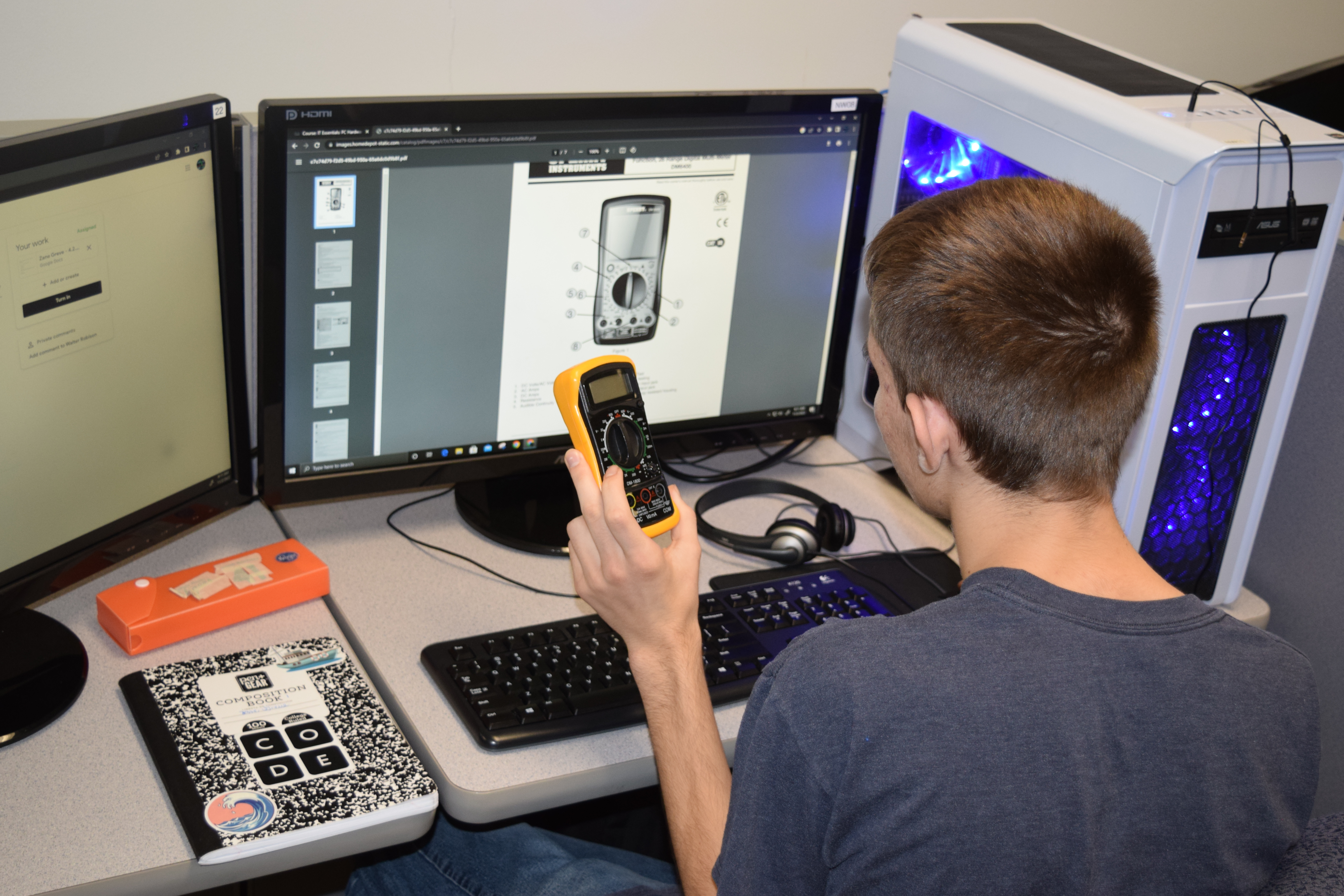 Students working with a multimeter